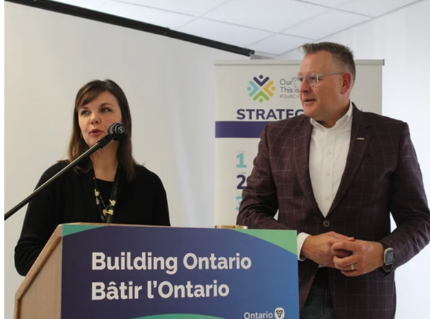 Erin Sleeth, interim president and CEO of the Brant Community Heathcare System, and Brantford-Brant MPP Will Bouma speak to a group gathered at Brantford General Hospital on Friday, March 8 after Bouma announced the province is providing an additional $5.25 million in funding to the hospital to address urgent infrastructure needs.