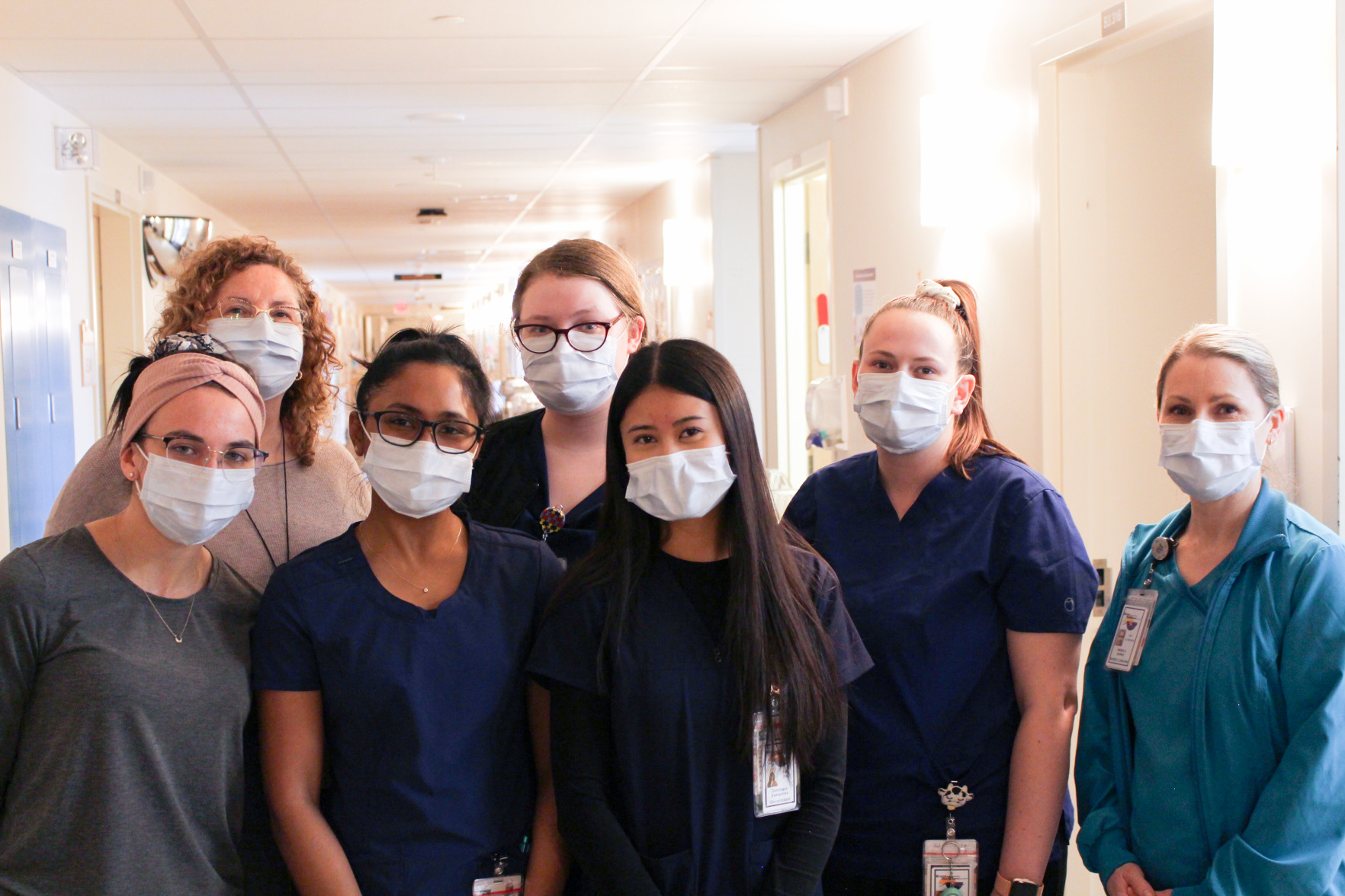 A group of five externs with their clinical coordinators