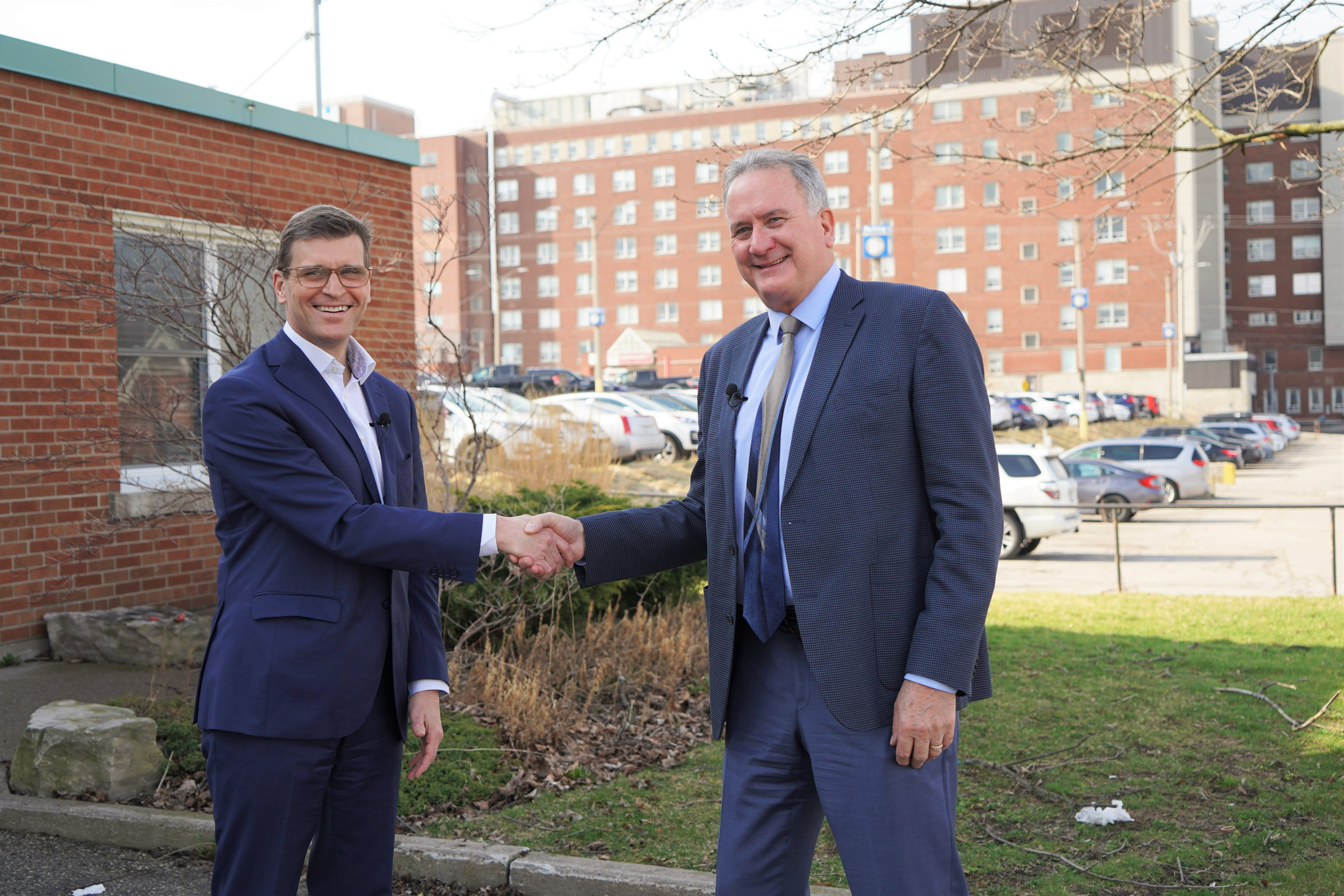 David McNeil (left), president and CEO of the Brant Community Healthcare System, and Brantford Mayor Kevin Davis on the site on St. Paul Avenue of a proposed nine-storey, 440-bed patient tower for Brantford General Hospital.