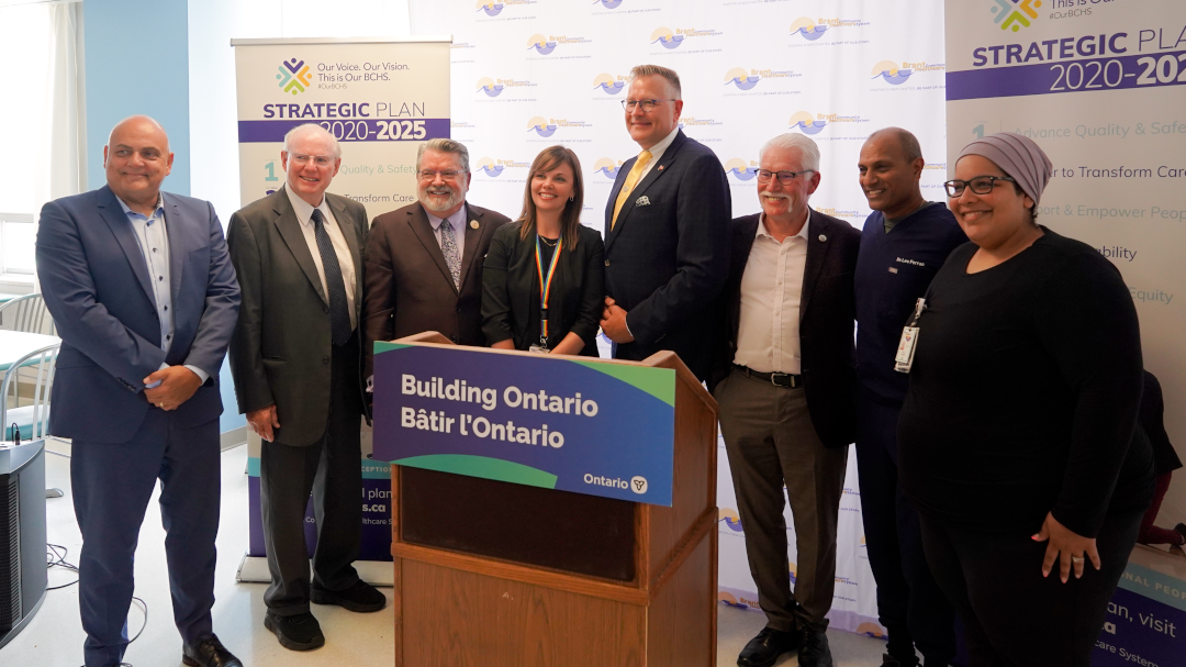 Local and hospital leaders celebrate the announcement on July 18