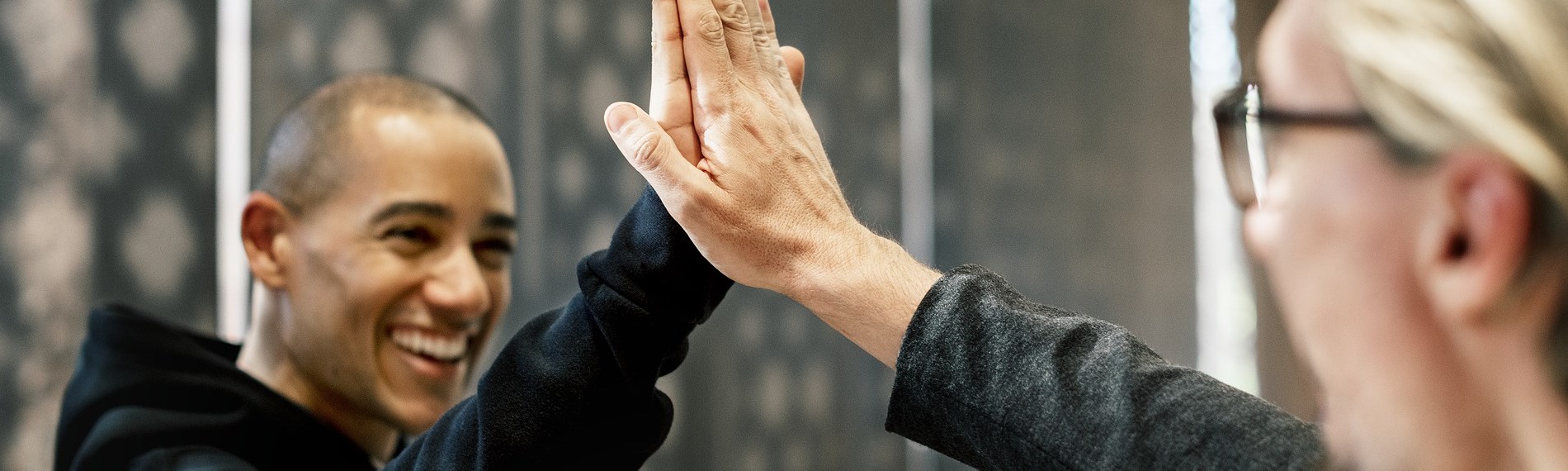 Two people giving a high five