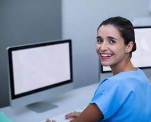 Healthcare Professional working on a computer